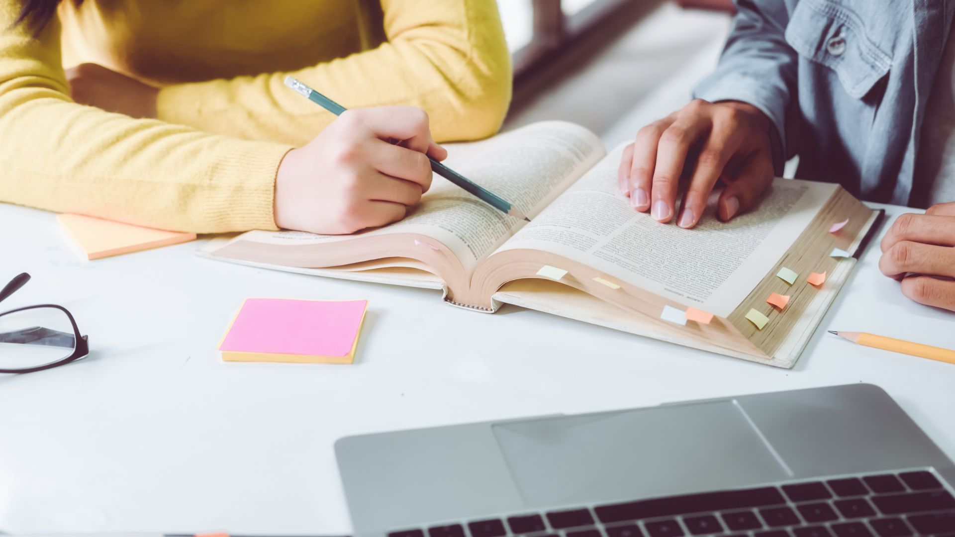 middle aged person studying a book