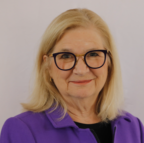 Image of woman with shoulder length blond hair and glasses